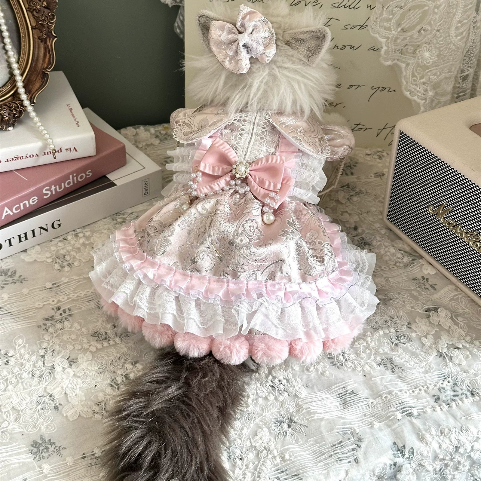 Peach pearl rhinestone pet dress worn by a cat from the back
