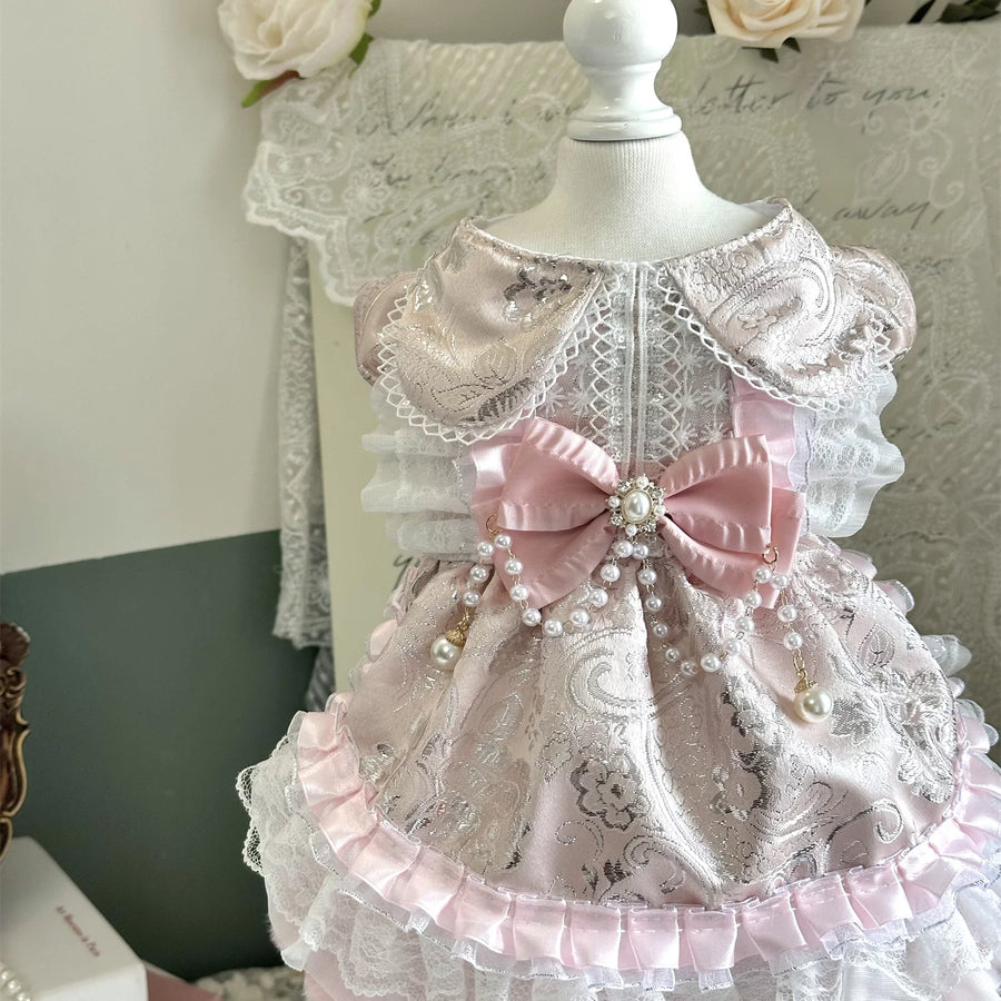 Peach pearl rhinestone pet dress close-up with bow and lace details